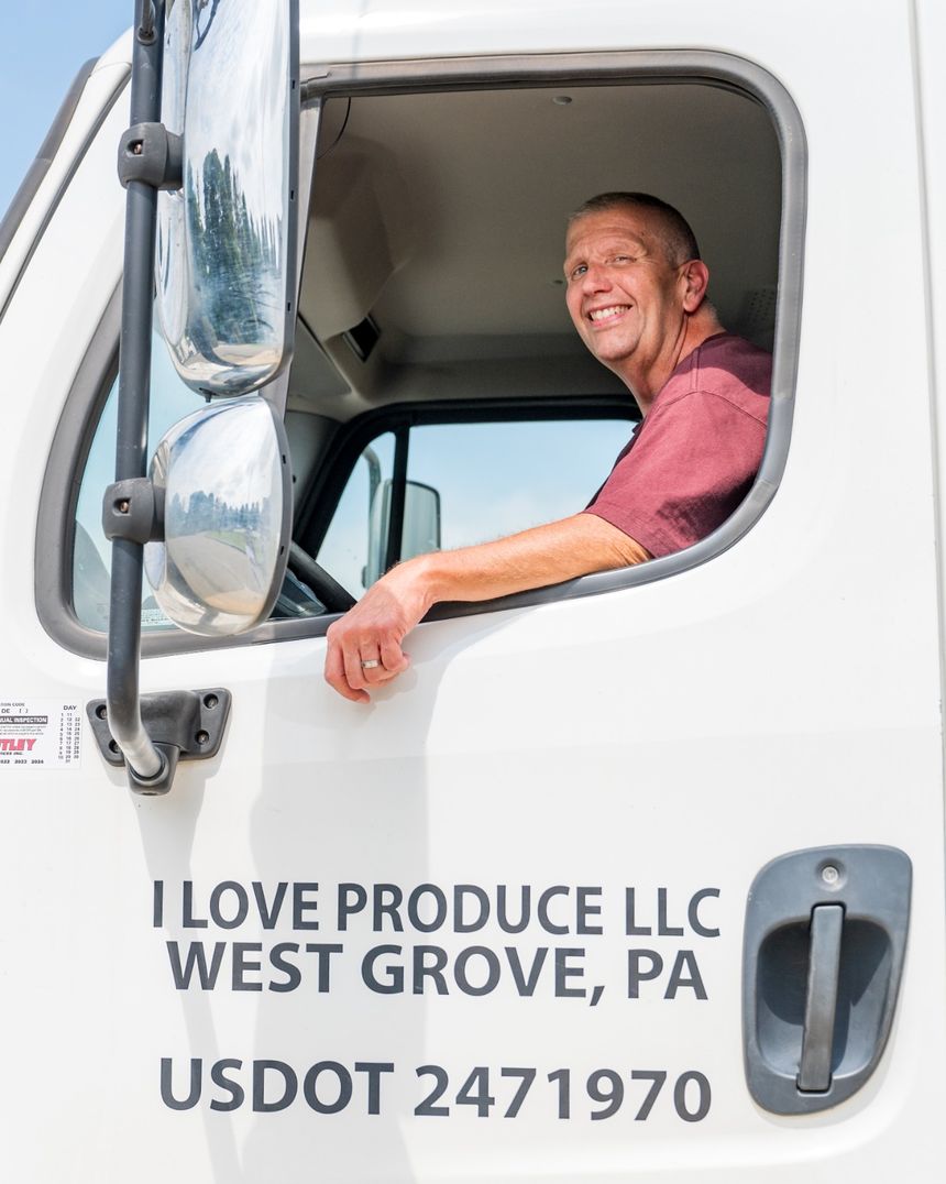 I Love Produce truck driver on delivery